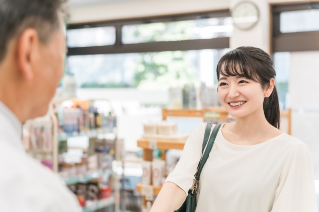 Japanese Drugstores Explained: What Travellers Should Know Traveller browsing Japanese drugstore shelves