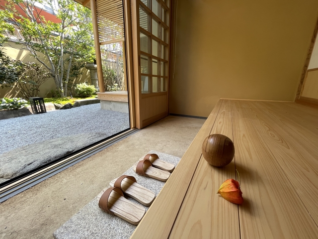 What Japanese Hotels Are Really Like: A Guide for Visitors Guest removing shoes at hotel room entrance in Japan