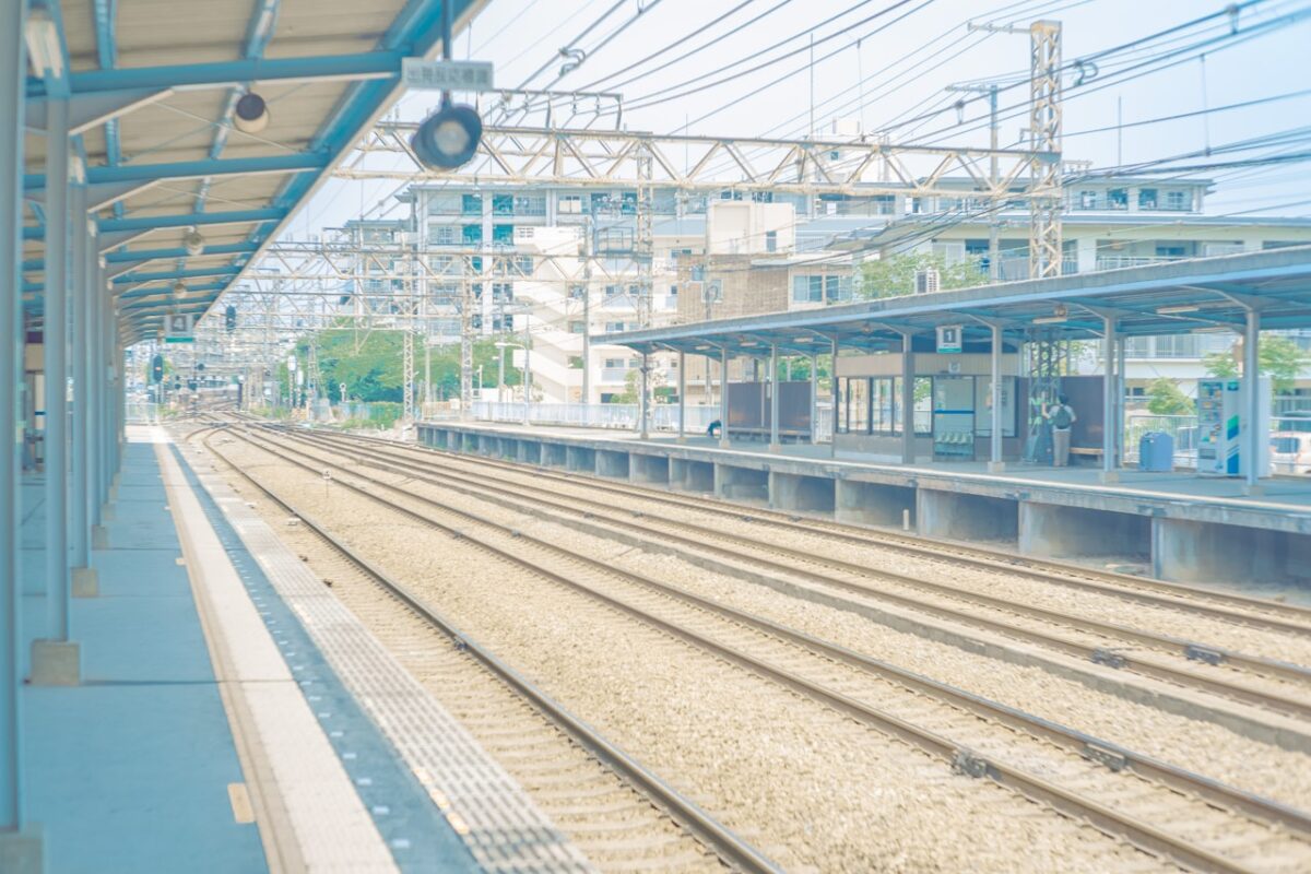 Will English Get You By in Japan? Where It Works — and Where a Little Japanese Helps A blue train at a station in Japan during the day