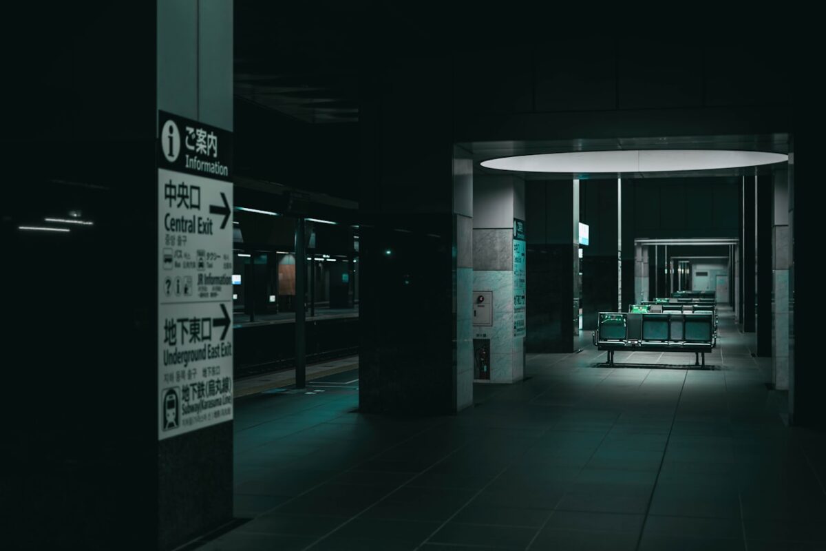 Will English Get You By in Japan? Where It Works — and Where a Little Japanese Helps Black and white kanji text on a sign in Japan
