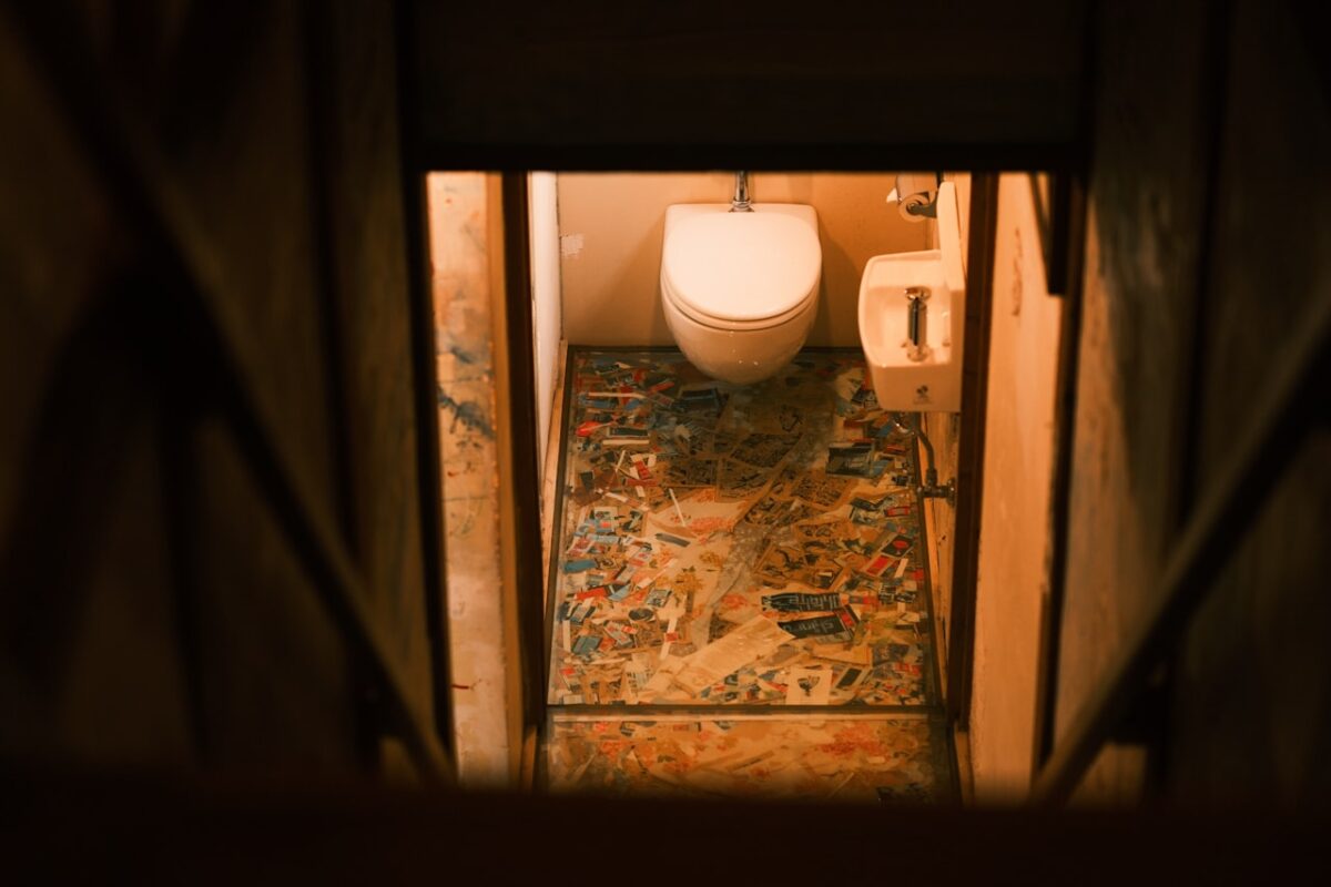 A public toilet at the bottom of a staircase in Japan