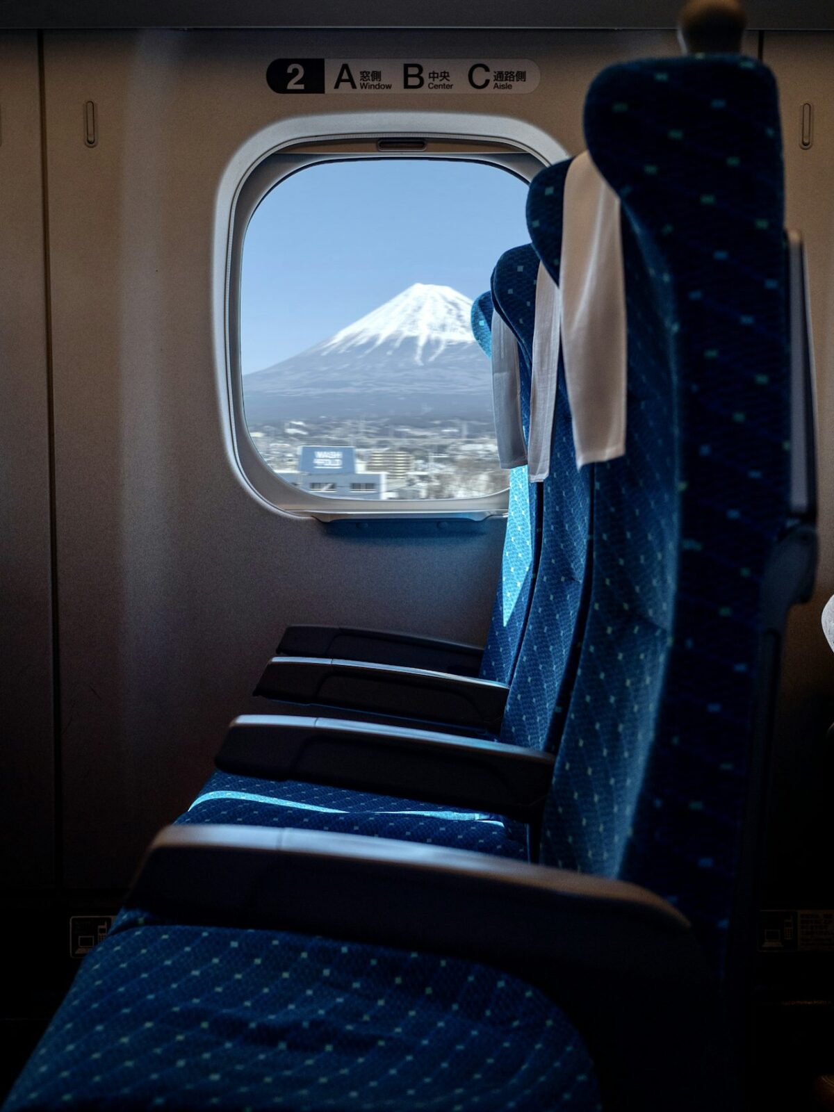 Getting Around Japan: A First-Timer's Guide to Trains, IC Cards and City Transport The interior seats of a Japanese train