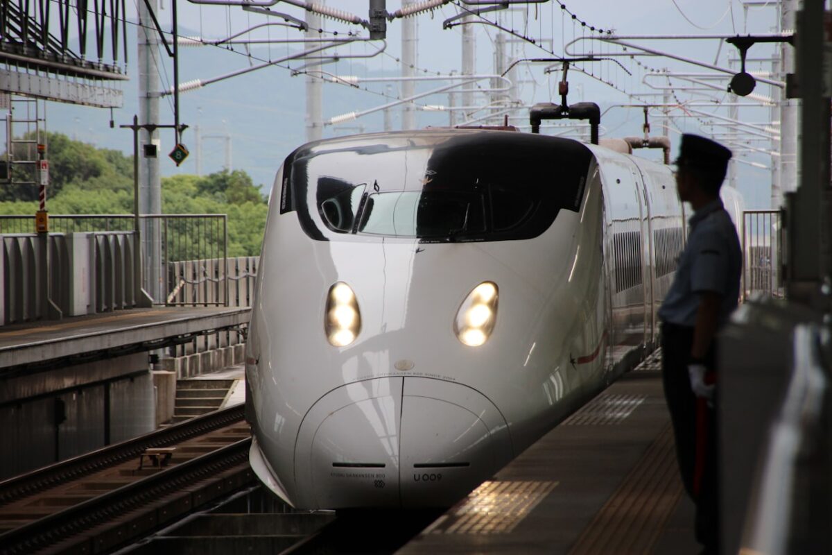 Getting Around Japan: A First-Timer's Guide to Trains, IC Cards and City Transport A white and black train on the rails in Japan