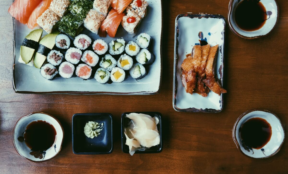 How Much Does a Trip to Japan Cost from the UK? A Realistic Breakdown An assortment of sushi, side dishes and soy sauce on a wooden table