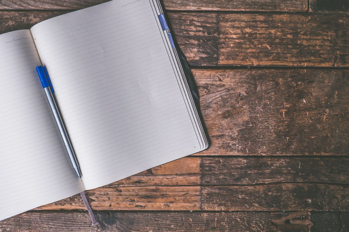 Learning Japanese with a Native Japanese Teacher in London (Taught in English): What to Expect An open ruled notebook and pen on a wooden table
