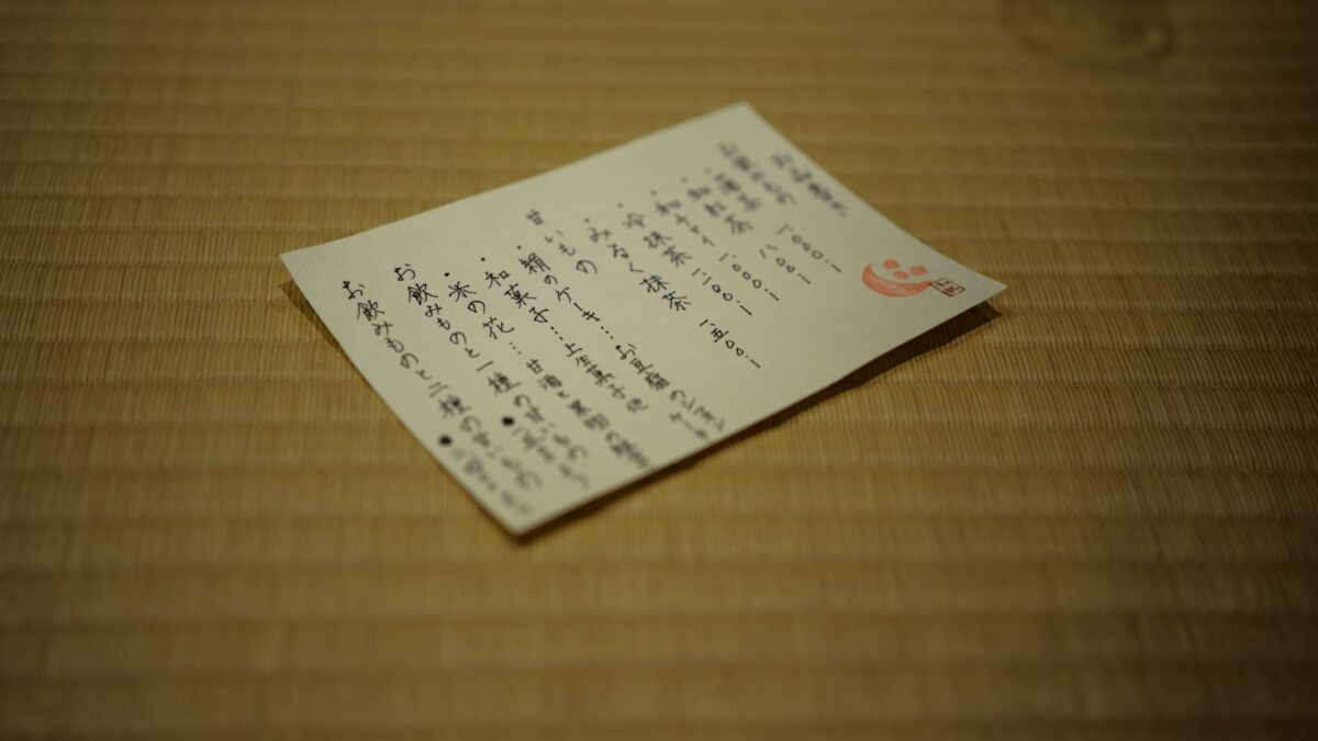 Hiragana, Katakana and Kanji: What to Learn First (and What You Can Skip for a Trip) A sheet of Japanese text resting on a woven mat