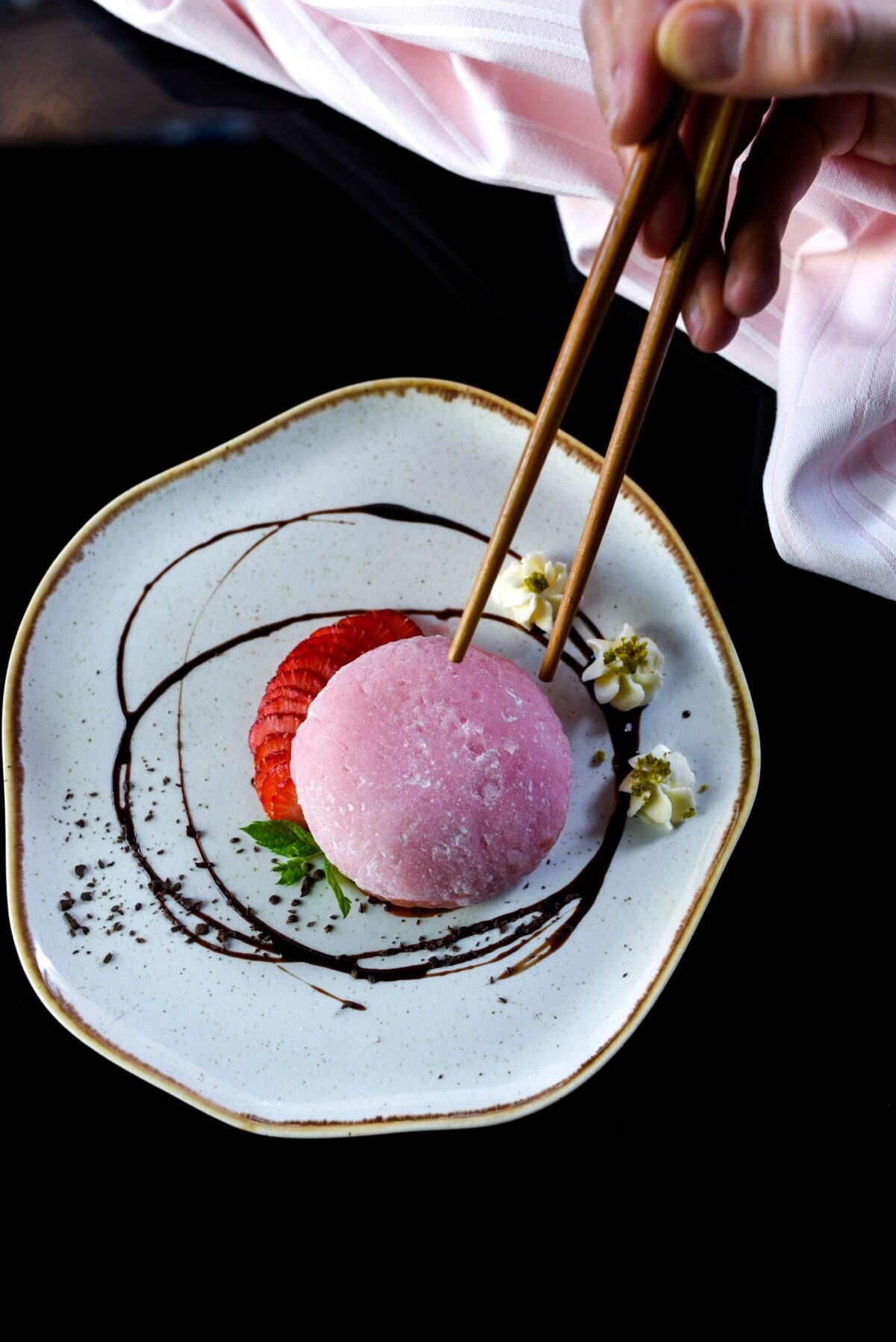 Pink sakura-flavoured Japanese sweet served on a plate for spring
